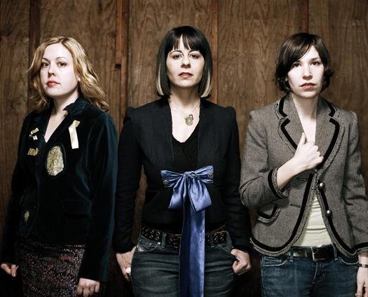 Sleater-Kinney reunite, announce new album, and announce their intent to smooch numerous cities on the face